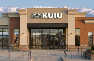 KUIU Denver store front with mountains in the background