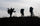 Three hunters skylined while packing out moose antlers and meat