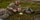 A hunter in Valo Camouflage relaxing on a hillside eating a tortilla.