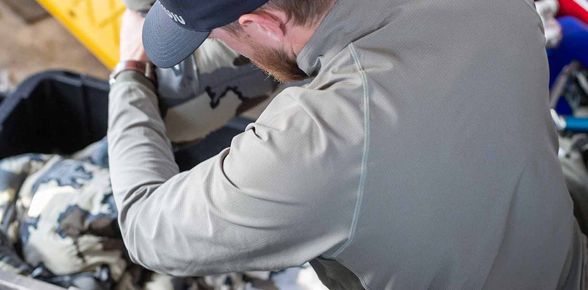 Back of Hunter Organizing Gear in Tiburon Hybrid Zip T in Stone Grey Color