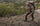 Hunter in Valo camouflage walking along a ridge while wearing a PRO 3600 Backpack