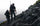 Front of Hunters in Vias Camouflage Hiking Across Talus Field