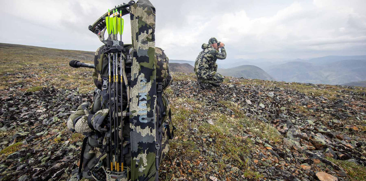 SFS Bow Kit in Verde Camouflage on Hoyt Bow with Hunter Glassing in Background