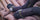 Close up photo showing a hunter wearing mid-weight mountain sock while seated on a sleeping pad
