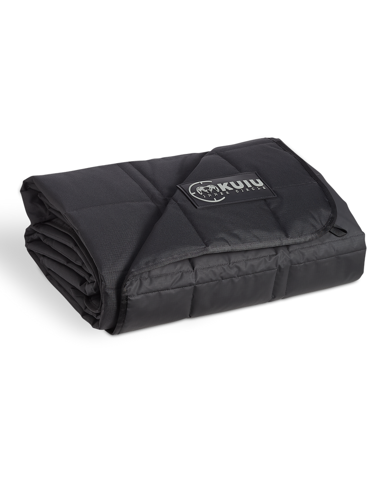 Inner Circle Distance AT Blanket in Black, shown folded with a KUIU sewn-in label.