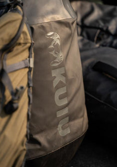 Close-up of KUIU Sheep logo on a duffel bag
