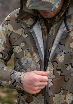 Hunter zipping up his StrongFleece 275 Full Zip Hoodie in Valo Camouflage