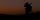 Side Silhouette of Hunter Glassing Game at Sunset