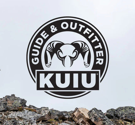 KUIU Guide and Outfitter Logo over Hunters Walking on Rocky Ridge