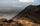 A backpack hunter hiking along a mountaintop.